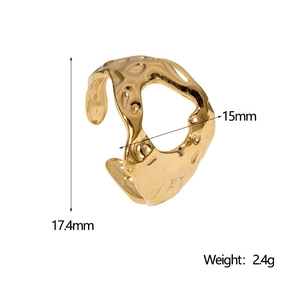 Macro view of gold-plated asymmetrical ring with size markings 17.4mm and 15mm