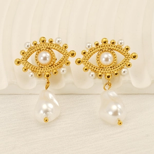 Detail of gold evil eye earrings with white pearls and large baroque pearl drop