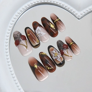 Vintage French style press-on nails with 3D floral patterns and ruby red gems