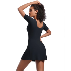 Rear view of a tight black athletic tennis dress with an open-back and short sleeves