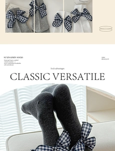 Detail of grey combed cotton mid-tube socks with a plaid bow tie for a vintage aesthetic