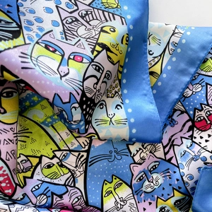 Detail of 90cm satin scarf featuring colorful cartoon cat prints and silky texture