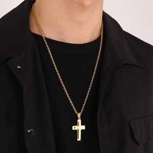 Golden titanium steel double-layer cross pendant necklace shown on a model