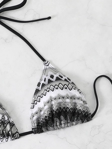 Detailed view of tribal geometric print bikini top with high-quality knitted texture