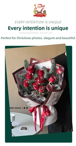 Christmas bouquet with red roses and pine branches in vintage festive wrapping paper