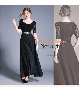 Detail of elegant black maxi dress featuring lace floral bodice and silver buckle belt