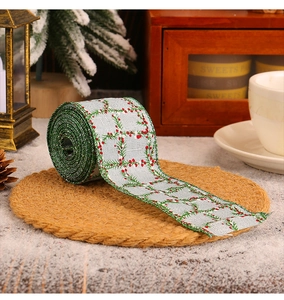 Detail of silver Christmas plaid ribbon with red berry patterns for DIY gift wrapping