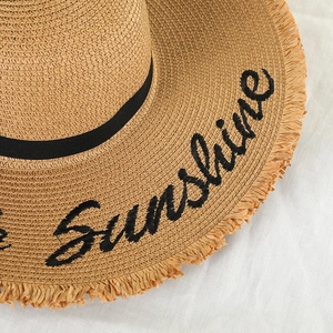Women's straw sun hat with 'Sunshine' embroidery, black ribbon and frayed brim detail