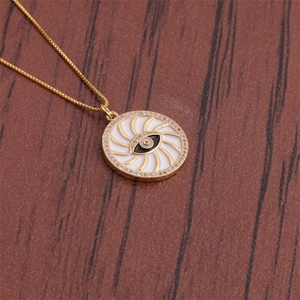 Macro detail of evil eye necklace with crystals on vintage wood background