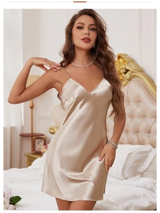 Close-up of champagne gold satin nightdress showing V-neck detail and silky texture