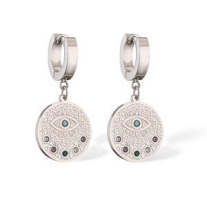 Detail of silver hoop earrings with hollow evil eye pendant and colorful gemstones