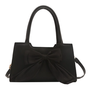 Minimalist summer handbag in black with large bow decoration and round handles
