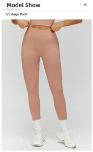 Detail of high waisted seamless yoga leggings in retro pink color with ribbed texture
