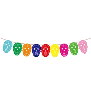 Close-up of colorful felt sugar skull banners for Dia de los Muertos party decor