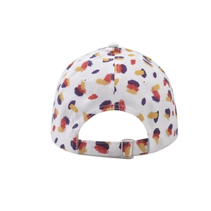 Detail of adjustable metal buckle and vibrant print on a white baseball cap back view