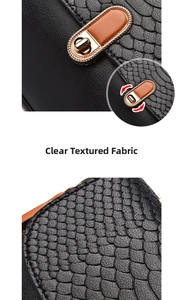 Close-up of black snake embossed leather texture and gold metal twist lock buckle