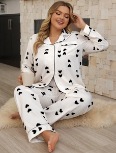 Detail of waffle knit heart print pajama set with black piping and single chest pocket
