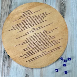 Wooden Farkle game rule board with blue dice on a rustic background for game enthusiasts
