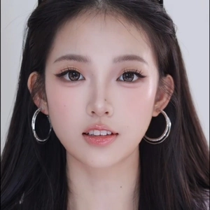Sparkling silver double hoop earrings worn by a model in a high-fashion portrait style