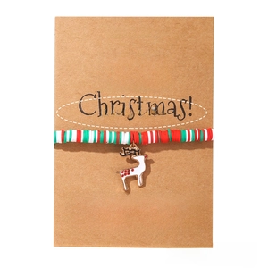 Christmas beaded bracelet with red white green clay discs and white reindeer enamel charm