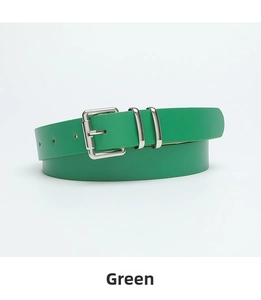Detail of slim emerald green leather belt with polished silver square buckle for dresses