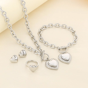 Polished silver heart jewelry set featuring O-chain necklace, bracelet, ring and earrings