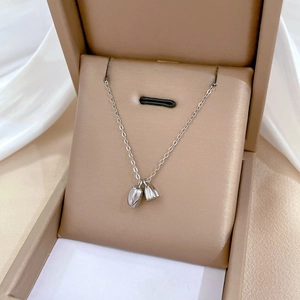 Minimalist titanium steel necklace with lotus pod pendants in elegant gift box