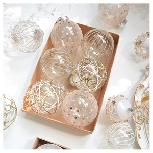 Detail of champagne lace mesh Christmas ornaments with gold glitter and pearl dots decor