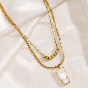 Elegant 18k gold double-layered necklace with rectangle white shell pendant on silk