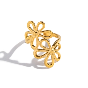 Detailed top view of gold double flower open ring with polished metallic finish
