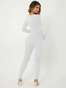 Detailed back view of a white long sleeve bodysuit showing ribbed texture and bodycon fit