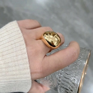 Chunky gold teardrop ring for women with high-shine mirror finish in minimalist style