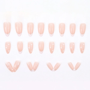French almond press-on nails with pink base, silver glitter tips and white heart patterns