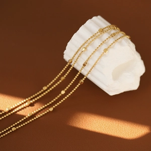 18K gold plated titanium double-layer bracelet with star cubes and beaded chains