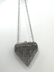 Elegant silver heart-shaped evening clutch bag encrusted with sparkling rhinestones