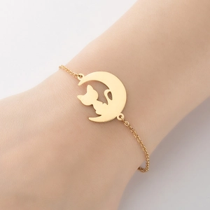Gold moon and cat pendant bracelet for women featuring a minimalist animal silhouette