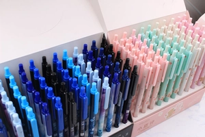 Close-up of bulk 0.5/0.7 mechanical pencils in pastel pink and green display boxes