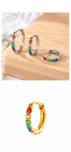 Detail of 8mm gold and silver earrings with rainbow zircon stones in macro view