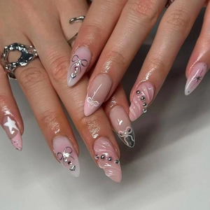 3D pink gradient stiletto press-on nails with silver bows and metallic beads