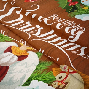 Detail of Christmas tapestry fabric showing woven texture, angel motif and festive text