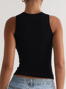Rear view of a black ribbed knit sleeveless tank top worn with blue denim shorts
