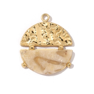 Detail of bohemian gold hammered metal and beige natural stone semi-circle pendant