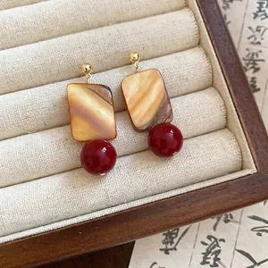 Vintage Chinese style earrings with marble square shell and deep red beads in jewelry box