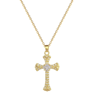 Luxurious gold titanium cross necklace with sparkling white crystals on white background