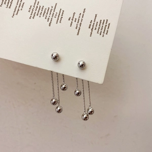Elegant silver metal ball tassel drop earrings featuring triple long chains on card