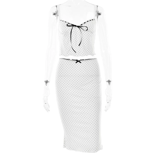 Two-piece white set with black polka dots, crop top and midi skirt with ribbon accents