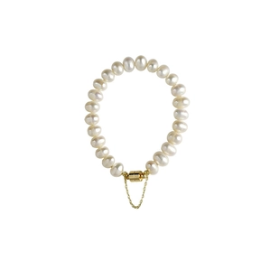 Elegant white freshwater pearl bracelet with gold magnetic clasp and safety chain for women