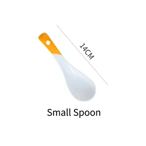 Detail of a 14cm long-handle dessert spoon with white body and orange handle