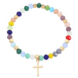 Macro shot of colorful faceted beads and golden cross pendant on a stainless steel bracelet