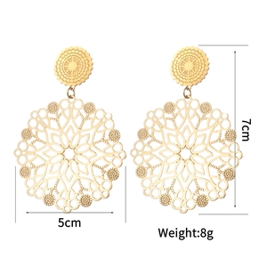 Detailed view of hollow patterned gold earrings showing 7cm length and 5cm width dimensions